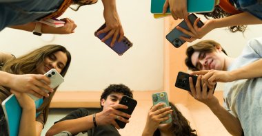 Restrictive school phone policies are not linked to better student mental wellbeing, a study has found and managing phone use can take schools more than 100 hours a week. (Shutterstock Photo)