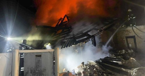Firefighters work to extinguish a fire at a private house following a Russian drone attack in Bogodukhiv, the Kharkiv region, Ukraine, Feb. 11, 2026. (AFP Photo)