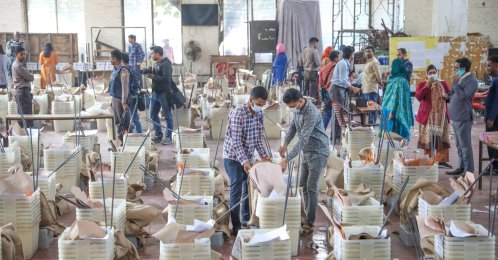 Election officials prepare voting materials and ballot boxes at a distribution center in Dhaka, Bangladesh, Feb. 11, 2026. (EPA Photo)