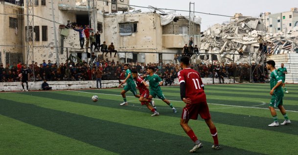 Palestinian football players take part in a friendly five-a-side tournament on a pitch surrounded by buildings destroyed during a two-year Israeli offensive, Gaza City, Palestine, Feb. 9, 2026. (Reuters Photo)