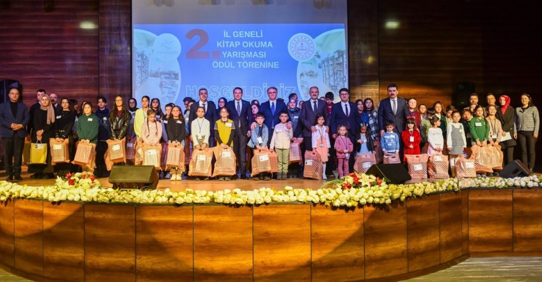 Governor Ozan Balcı poses with students and officials during a reading event, Van, eastern Türkiye, Feb. 11, 2026. (Courtesy of Van Governorate)