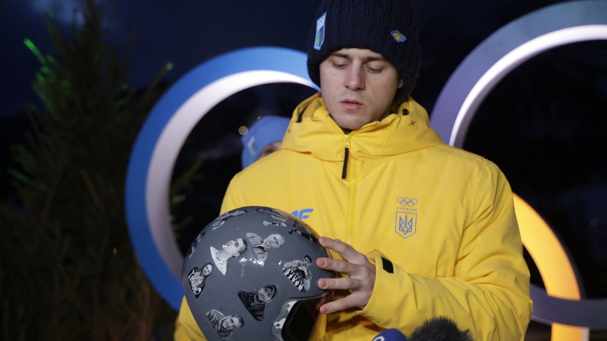 Vladyslav Heraskevych of Ukraine displays his helmet that serves as a tribute to athletes who have died amid Russia's attack on Ukraine during a press conference, Cortina d'Ampezzo, Italy, Feb. 10, 2026. (Reuters Photo)