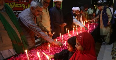 People light candles at a memorial for the victims of a mosque suicide bombing, Karachi, Pakistan, Feb. 10, 2026. (EPA Photo)