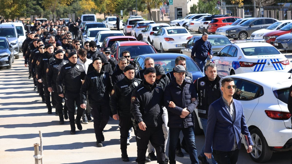 Turkish police escort suspects detained over FETÖ links to the courthouse, southern Antalya province, Türkiye, Feb. 24, 2025. (AA Photo)