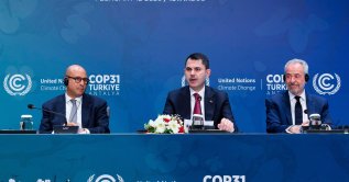Environment, Urbanization and Climate Change Minister Murat Kurum (C) speaks next to United Nations Climate Change Executive Secretary Simon Stiell (L) and COP30 President Andre Correa do Lago (R) during a news conference, Istanbul, Türkiye, Feb. 12, 2026. (AFP Photo)