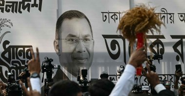 A poster of Bangladesh Nationalist Party chairman and election candidate Tarique Rahman is displayed as supporters gather outside the party office, Dhaka, Bangladesh, Feb. 13, 2026. (AFP Photo)
