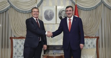 Vice President Cevdet Yılmaz (R) and Turkish Republic of Northern Cyprus (TRNC) Prime Minister Ünal Üstel shake hands before a meeting, Ankara, Türkiye, Feb. 12, 2026. (AA Photo)