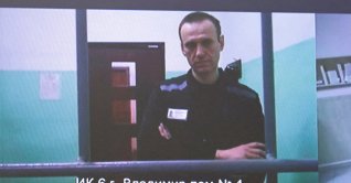 Russian opposition politician Alexei Navalny appears on a screen via video link from the IK-6 penal colony in the Vladimir region, during a court hearing to consider an appeal against his sentence in the criminal case on numerous charges, including the creation of an extremist organization, in Moscow, Russia, Sept. 26, 2023. (Reuters Photo)
