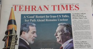 An Iranian newspaper with a cover photo of Iran's Foreign Minister Abbas Araqchi and U.S. Middle East envoy Steve Witkoff, in Tehran, Iran, Feb. 7, 2026. (Reuters Photo)
