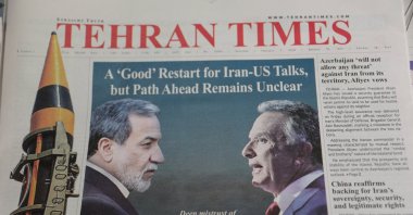 An Iranian newspaper with a cover photo of Iran's Foreign Minister Abbas Araqchi and U.S. Middle East envoy Steve Witkoff, in Tehran, Iran, Feb. 7, 2026. (Reuters Photo)