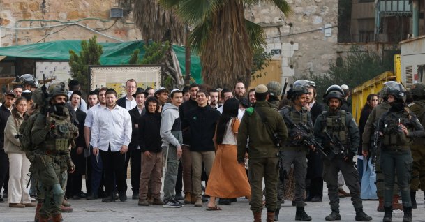 Israeli soldiers stand guard during a weekly settlers' tour in Hebron, in the Israeli-occupied West Bank, Feb. 14, 2026. (Reuters Photo)