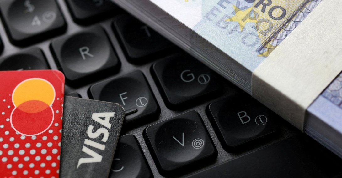 Euro banknotes, Visa and Mastercard cards are placed on a keyboard in this illustration taken on Sept. 24, 2025. (Reuters Photo)