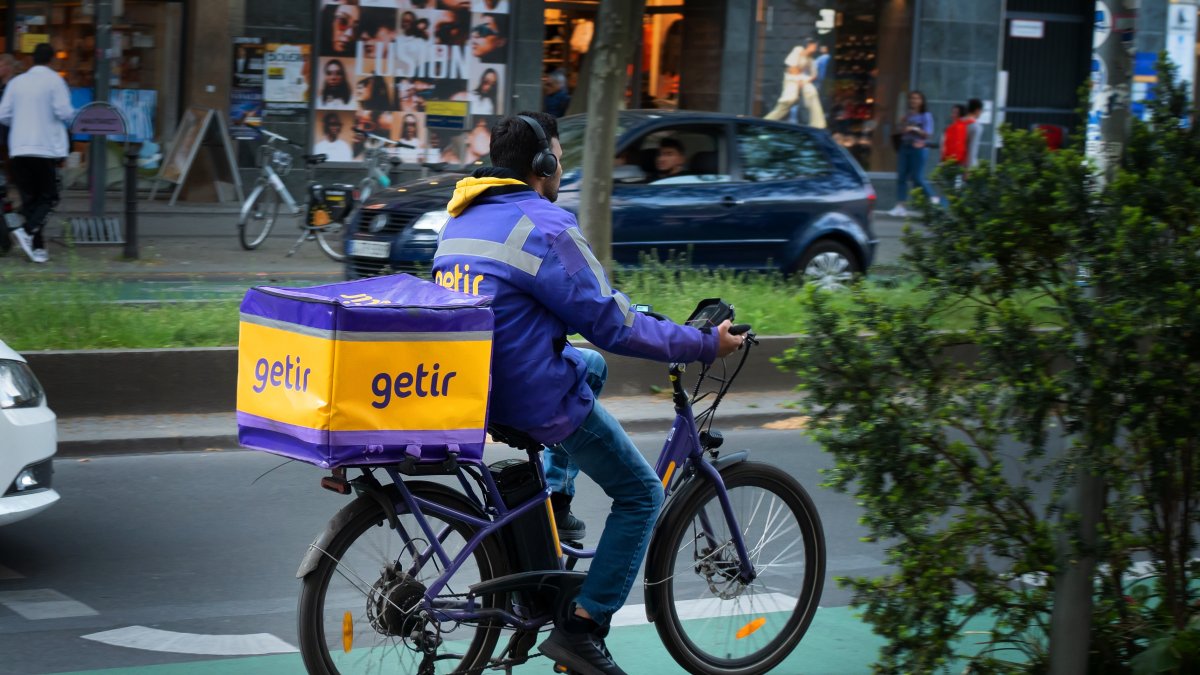 A worker for the delivery service Getir rides his bicycle, Berlin, Germany, May 20, 2023. (dpa Photo)