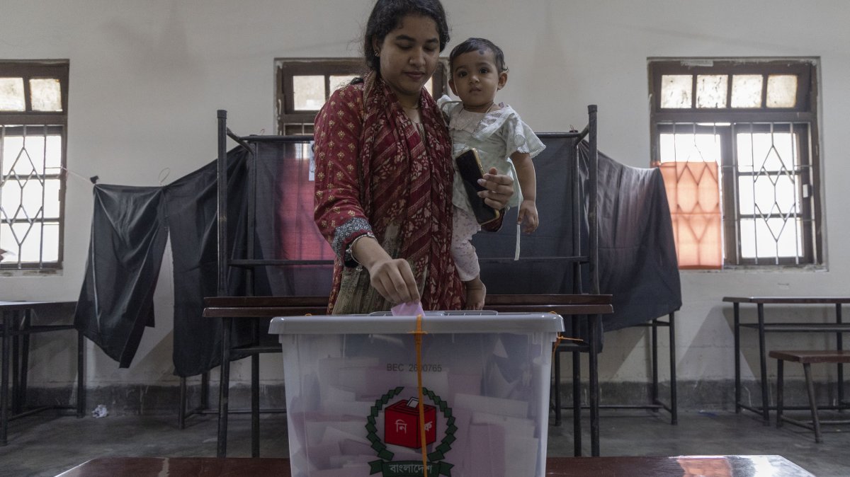 A woman casts her vote at a polling center during the 2026 general election in Dhaka, Bangladesh, Feb. 12, 2026. (AA Photo)