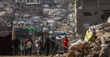 Internally displaced Palestinians walk among the ruins of the Al Tuffah neighborhood in eastern Gaza City, Feb. 11, 2026. (EPA Photo)