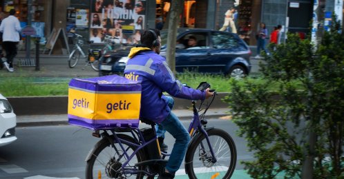 A worker for the delivery service Getir rides his bicycle, Berlin, Germany, May 20, 2023. (dpa Photo)