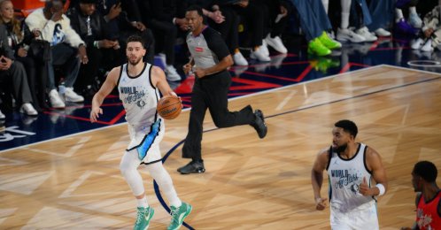 World Team players Alperen Şengün (L) and Karl-Anthony Towns contest a play during the 2026 NBA All-Star Game between USA Stars and World teams at Intuit Dome, Inglewood, California, U.S., Feb. 15, 2026. (AA Photo)
