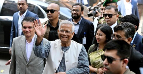 Muhammad Yunus, chief adviser of Bangladesh's interim government, gestures as he arrives to cast his ballot at a polling station during Bangladesh's general election in Dhaka, Feb.12, 2026. (AFP Photo)