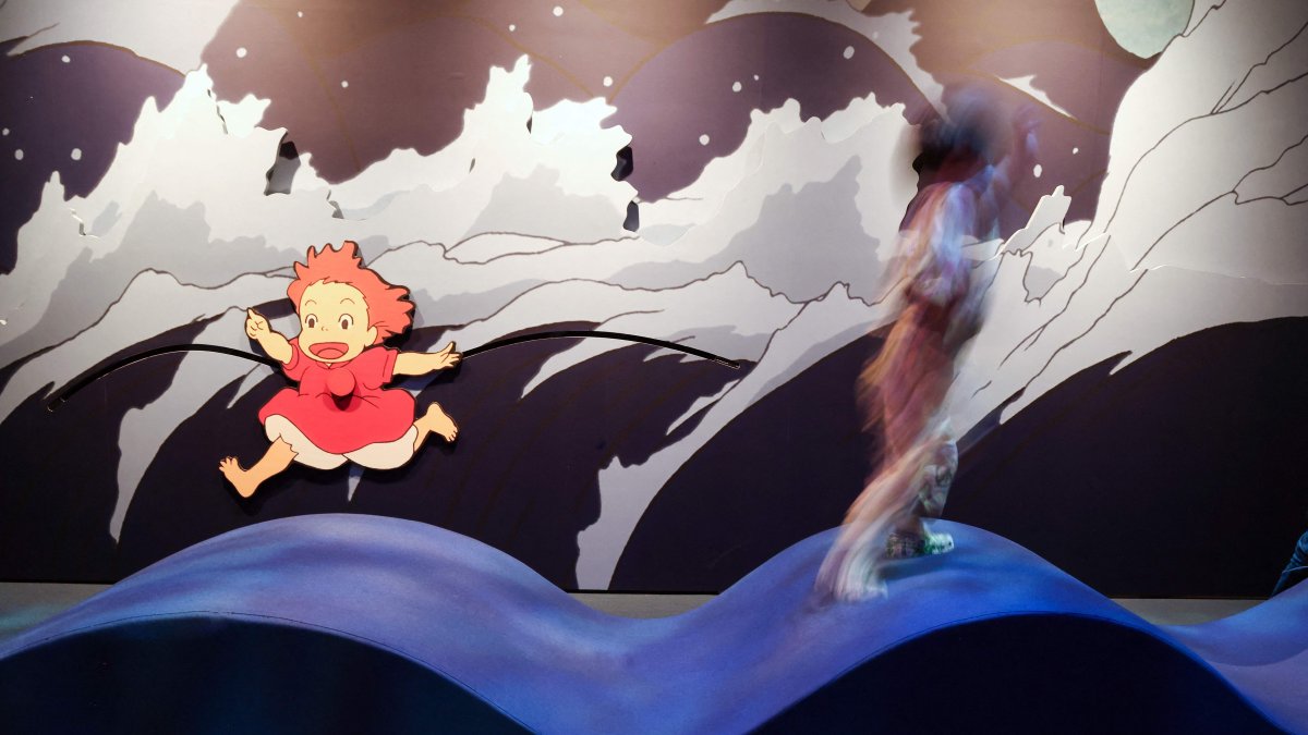A child plays with an animated character at the Academy Museum Studio Ghibli's PONYO media preview, Los Angeles, U.S., Feb. 12, 2026. (AFP Photo)