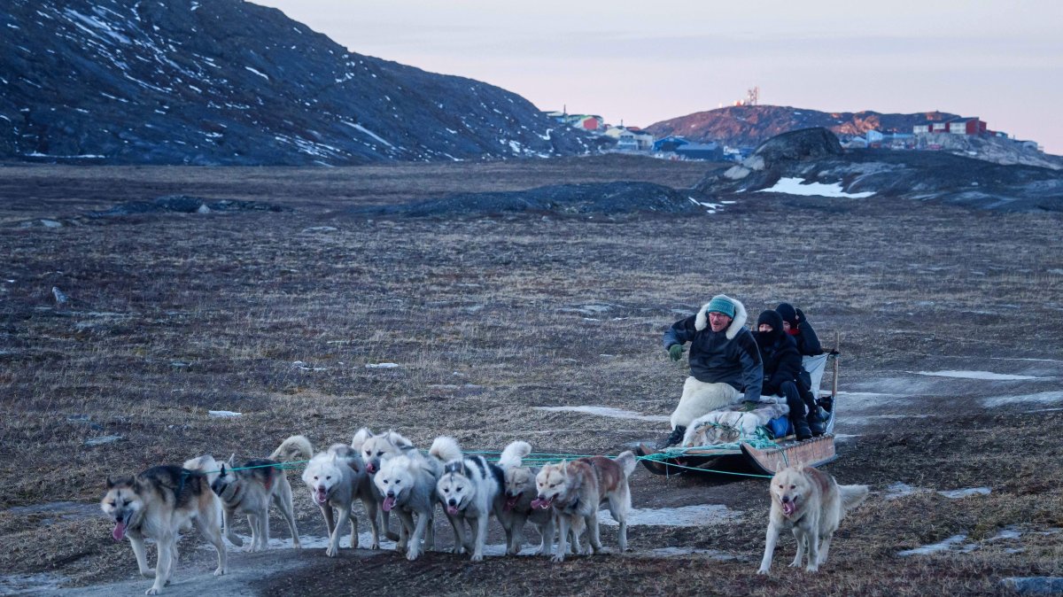 Greenland dog sledder faces winter without ice as climate warms