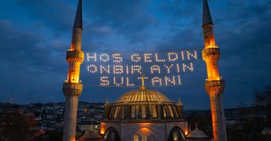 An aerial view of Valide-i Cedid Mosque illuminated with mahya lights during Ramadan, Üsküdar, Istanbul, Türkiye, March 1, 2025. (Shutterstock Photo)