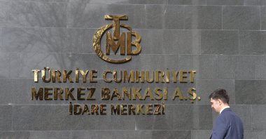 A man walks in front of the headquarters of the Central Bank of the Republic of Türkiye (CBRT), Ankara, Türkiye, Feb. 8, 2024. (EPA Photo)