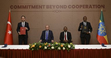 Energy and Natural Resources Minister Alparslan Bayraktar (L) and Ethiopian Minister of Water and Energy, Habtamu Itafa (R) pose alongside President Recep Tayyip Erdoğan and Ethiopia's Prime Minister Abiy Ahmed (sitting on right) after signing an energy agreement, Addis Ababa, Ethiopia, Feb. 17, 2026. (AA Photo)
