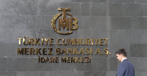 A man walks in front of the headquarters of the Central Bank of the Republic of Türkiye (CBRT), Ankara, Türkiye, Feb. 8, 2024. (EPA Photo)
