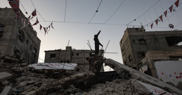 Displaced Palestinians hang decorations over the rubble of their destroyed homes as they prepare to welcome the holy month of Ramadan in Khan Yunis, southern Gaza Strip, Feb. 15, 2026. (EPA Photo)
