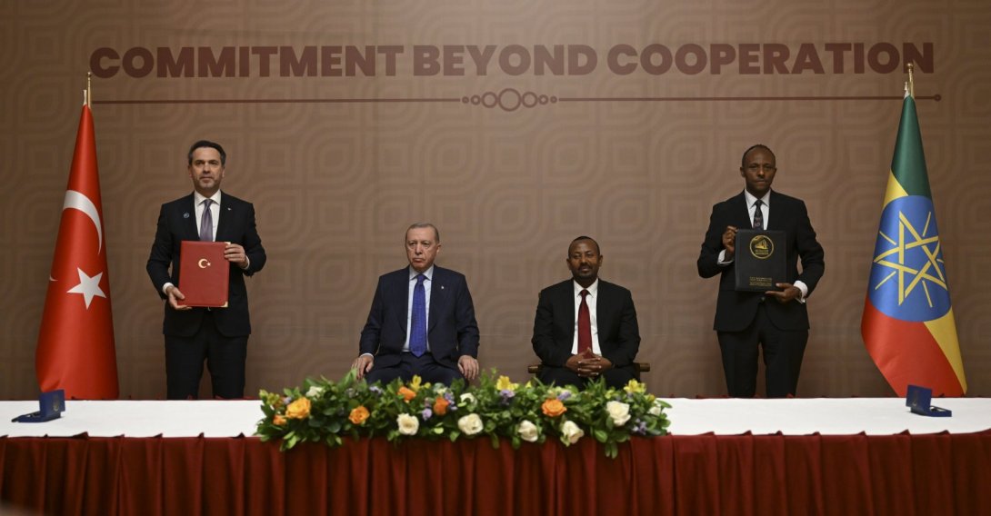 Energy and Natural Resources Minister Alparslan Bayraktar (L) and Ethiopian Minister of Water and Energy, Habtamu Itafa (R) pose alongside President Recep Tayyip Erdoğan and Ethiopia's Prime Minister Abiy Ahmed (sitting on right) after signing an energy agreement, Addis Ababa, Ethiopia, Feb. 17, 2026. (AA Photo)