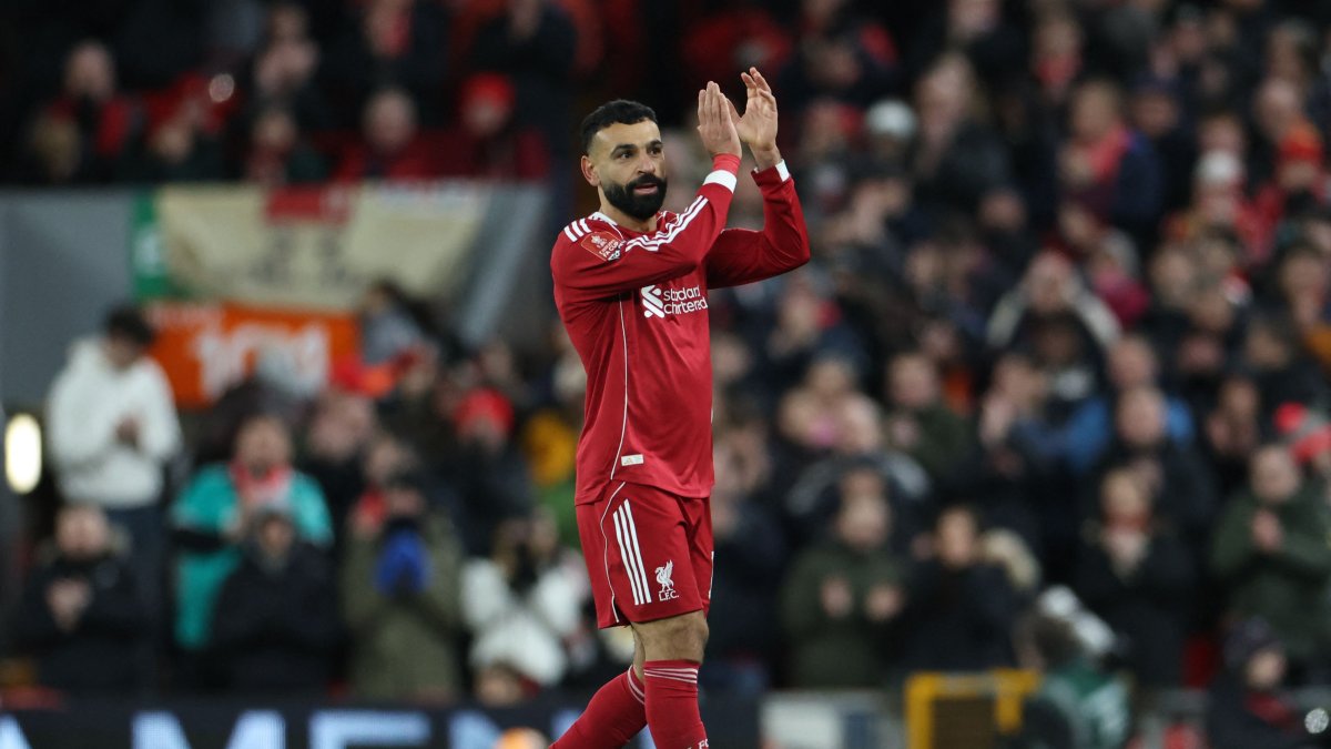 Liverpool's Mohamed Salah applauds the fans as he leaves the game, substituted during the English FA Cup fourth-round football match between Liverpool and Brighton and Hove Albion at Anfield, Liverpool, U.S., Feb. 14, 2026. (AFP Photo)