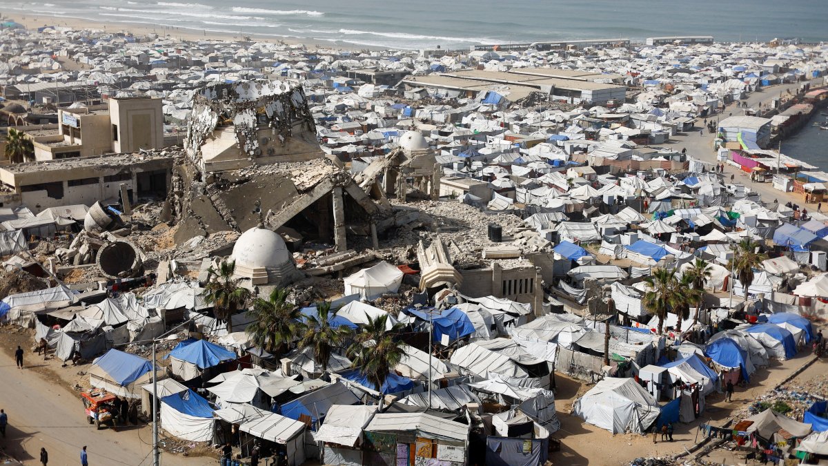 A mosque, destroyed during the two-year Israeli offensives, is surrounded by tents for displaced Palestinians, Gaza, Palestine, Feb. 15, 2026. (Reuters Photo)