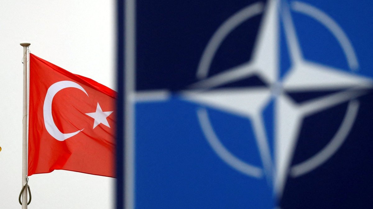 A Turkish flag flies next to the NATO logo at the alliance's headquarters in Brussels, Belgium, Nov. 26, 2019. (Reuters File Photo)