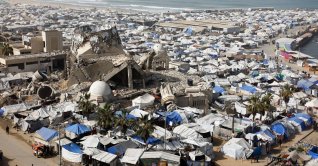 A mosque, destroyed during the two-year Israeli offensives, is surrounded by tents for displaced Palestinians, Gaza, Palestine, Feb. 15, 2026. (Reuters Photo)