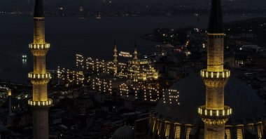 
An aerial view shows illuminated Ramadan mahyas displayed between the minarets of Süleymaniye Mosque and Yeni Mosque in Istanbul, Feb. 18, 2026. (IHA Photo)