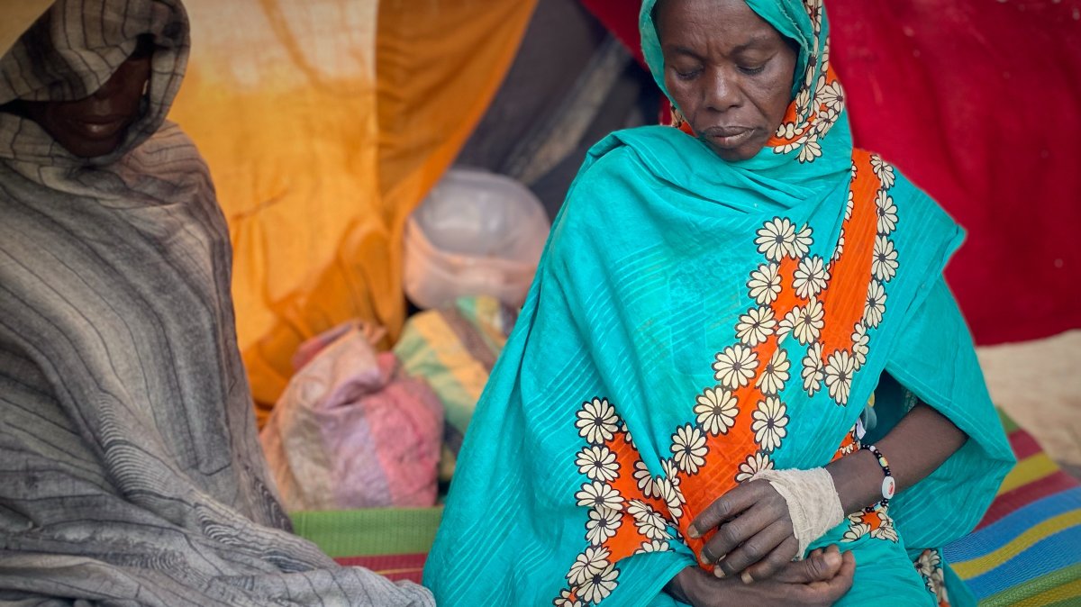 An injured Sudanese woman who fled el-Fasher city, after Sudan's paramilitary forces killed hundreds of people in the western Darfur region, rests in a tent at a camp in Tawila, Sudan, Oct. 31, 2025. (AP Photo)