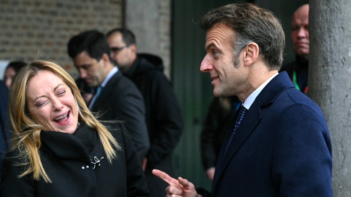 Italy's Prime Minister Giorgia Meloni reacts as she speaks with France's President Emmanuel Macron during the Informal EU Leaders' Retreat at the Alden Biesen Castle, Belgium, Feb. 12, 2026. (AFP Photo)