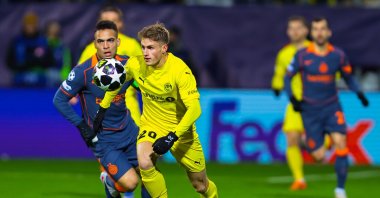 Bodo/Glimt's Fredrik Sjovold (R) and Inter's Lautaro Martinez in action in the UEFA Champions League playoffs, in Bodo, Norway, Feb. 18, 2026. (EPA Photo)