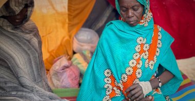 An injured Sudanese woman who fled el-Fasher city, after Sudan's paramilitary forces killed hundreds of people in the western Darfur region, rests in a tent at a camp in Tawila, Sudan, Oct. 31, 2025. (AP Photo)