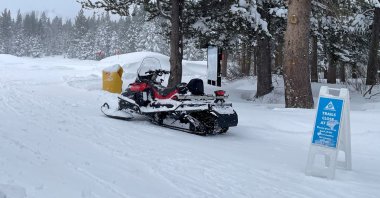 A snowmobile is parked at Alder Creek Adventure Center during a search after a Sierra Nevada avalanche near Truckee, California, U.S., Feb. 18, 2026. (Reuters Photo)