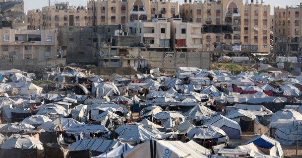 Palestinians displaced during the two-year Israeli offensive shelter at a tent camp in Khan Younis in the southern Gaza Strip, Feb. 10, 2026. (Reuters Photo)