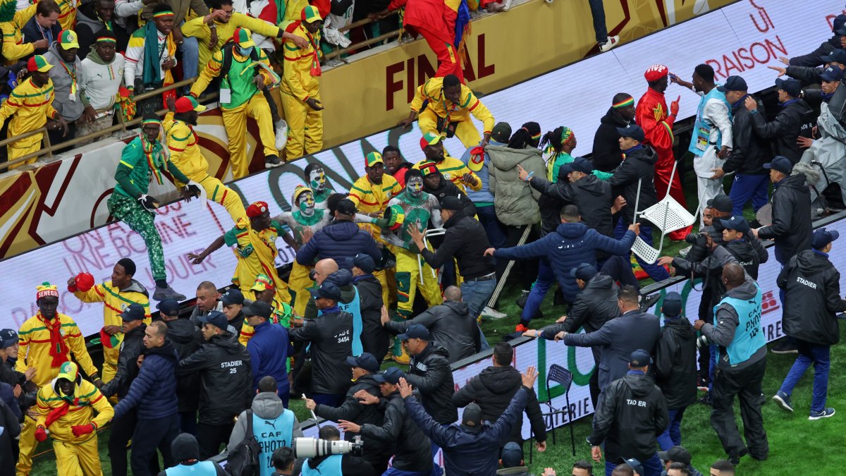 Senegal supporters clash with security services after a controversial penalty was awarded to Morocco late on during the Africa Cup of Nations final match between Senegal and Morocco, Rabat, Morocco, Jan. 18, 2026. (AP Photo)