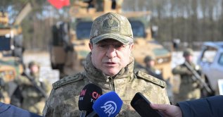 Gen. Selçuk Bayraktaroğlu speaks to journalists at NATO's Steadfast Dart 2026 military exercise in Germany, Feb. 20, 2026. (AA Photo)