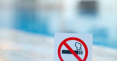 A no-smoking sign at a outdoor public area. (Shutterstcok Photo) 