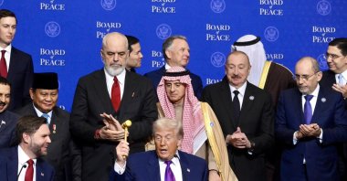 U.S. President Donald Trump (C) raises the gavel during the Board of Peace meeting at the Donald J. Trump U.S. Institute of Peace, Washington, U.S., Feb. 19, 2026. (EPA Photo)