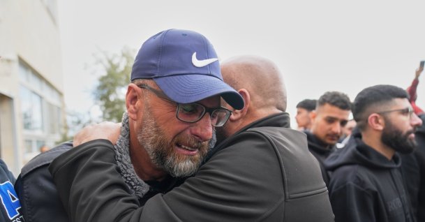 Mourners offer condolences to Mohammad Abu Siyam, father of 19-year-old Palestinian American Nasrallah Abu Siyam, who the Palestinian Health Ministry said was shot by settlers the previous night, during his funeral in the West Bank village of Mukhmas, Ramallah, Palestine, Feb. 19, 2026. (AP Photo)