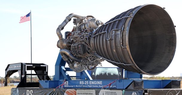 One of the massive RS-25 engines for NASA's Artemis II Space Launch System (SLS) rocket is displayed near the countdown clock at Kennedy Space Center in Cape Canaveral, Florida, Feb. 20, 2026. (AFP Photo)