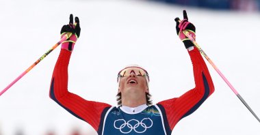 Johannes Hoesflot Klaebo of Norway crosses the finish line to win gold at the Milano Cortina 2026 Olympics, at Tesero Cross-Country Skiing Stadium, Lago, Italy, Feb. 21, 2026. (Reuters Photo)