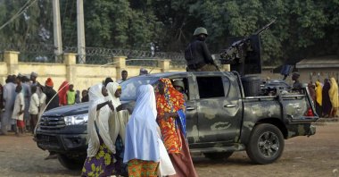 Parents are reunited with their abducted daughters in Jangabe, Zamfara state, Nigeria, March 3, 2021. (AP Photo)