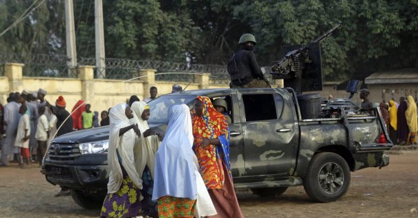 Parents are reunited with their abducted daughters in Jangabe, Zamfara state, Nigeria, March 3, 2021. (AP Photo)